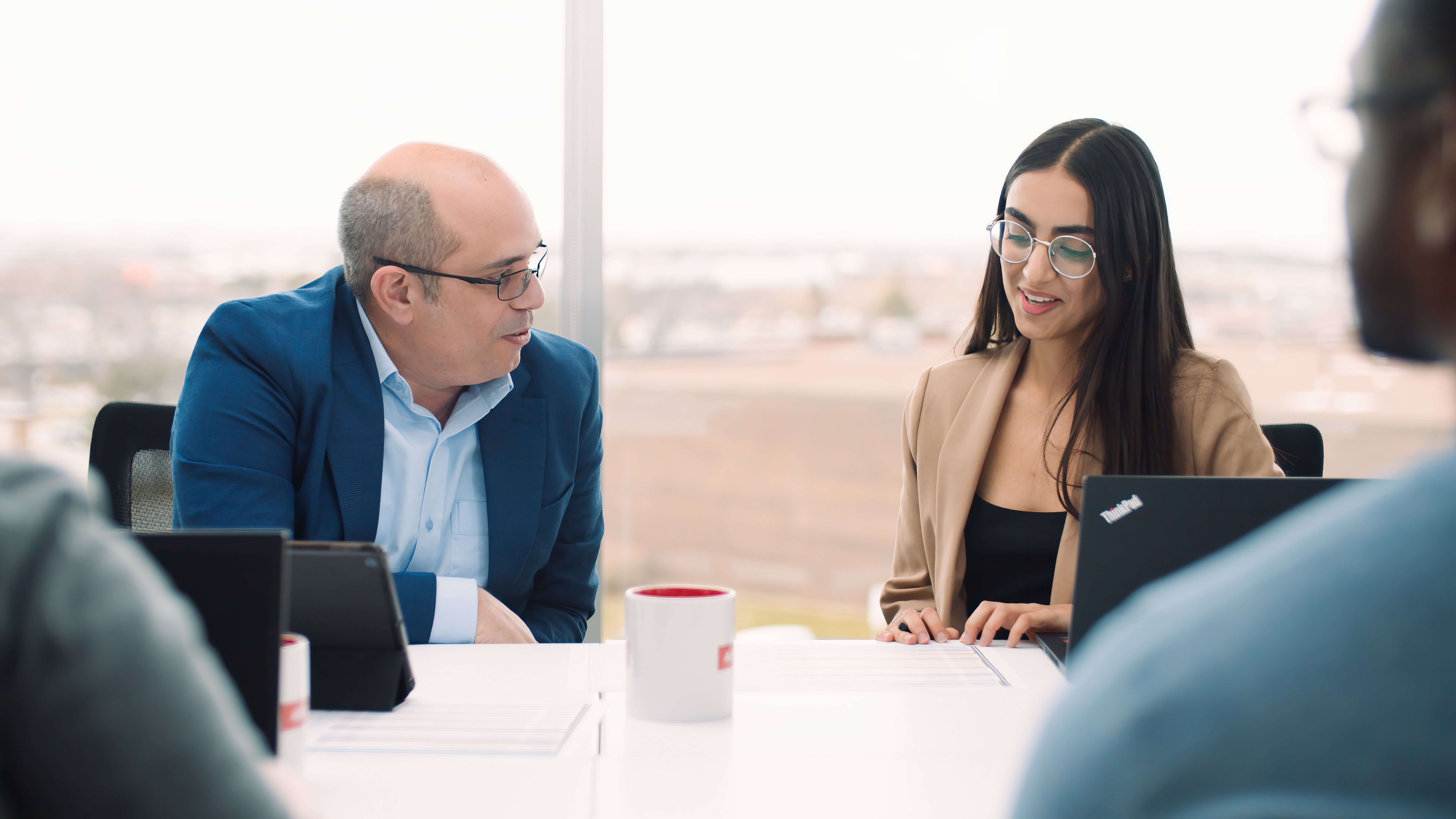 Two people talking in a meeting